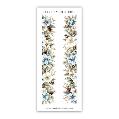 a white bookmark with blue flowers and pine cones