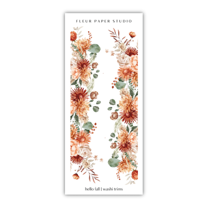 a floral bookmark with orange flowers and leaves