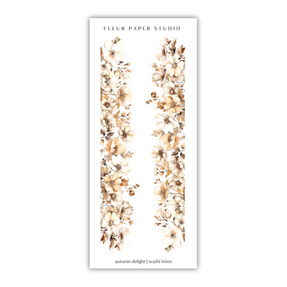 a white bookmark with flowers on it