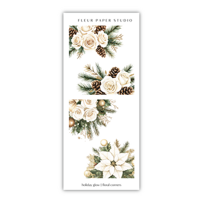 a white bookmark with white flowers and pine cones